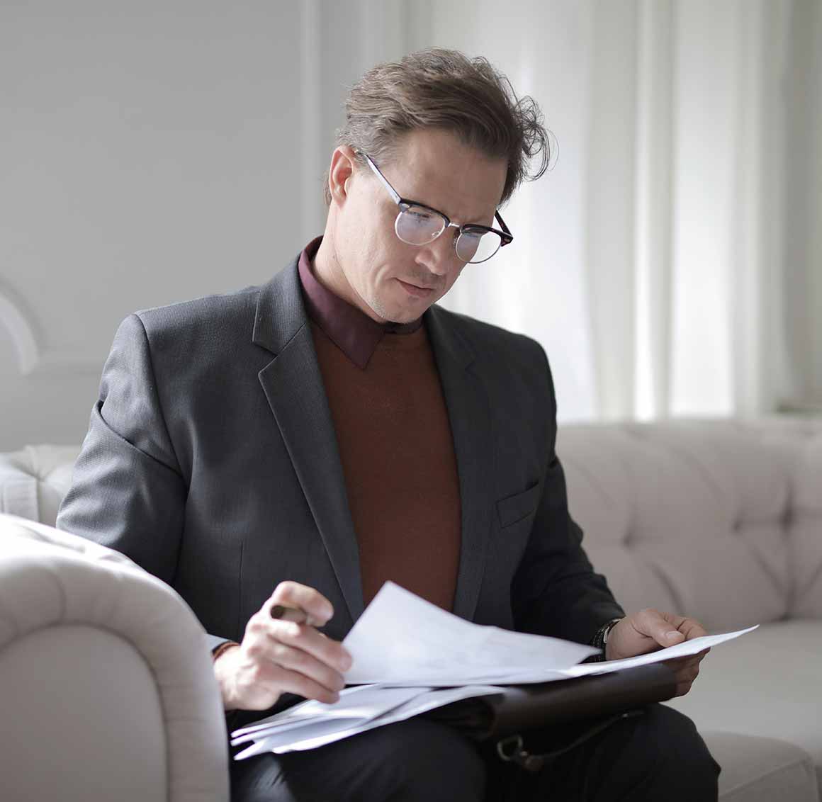 Entrepreneur checking business profile and UEN documents after successful Singapore company setup