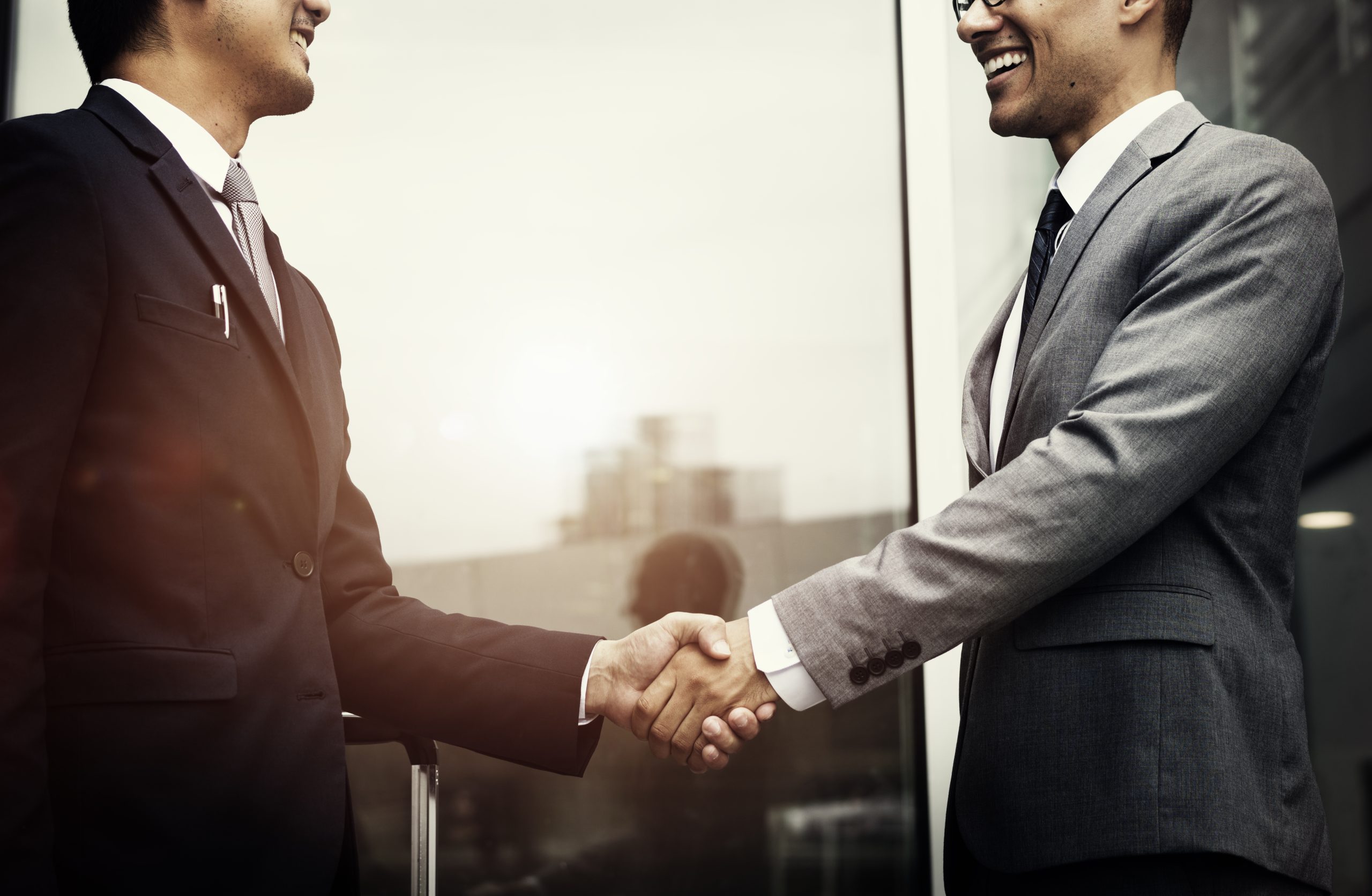 corporate-businessmen-shaking-hands (1) (2)
