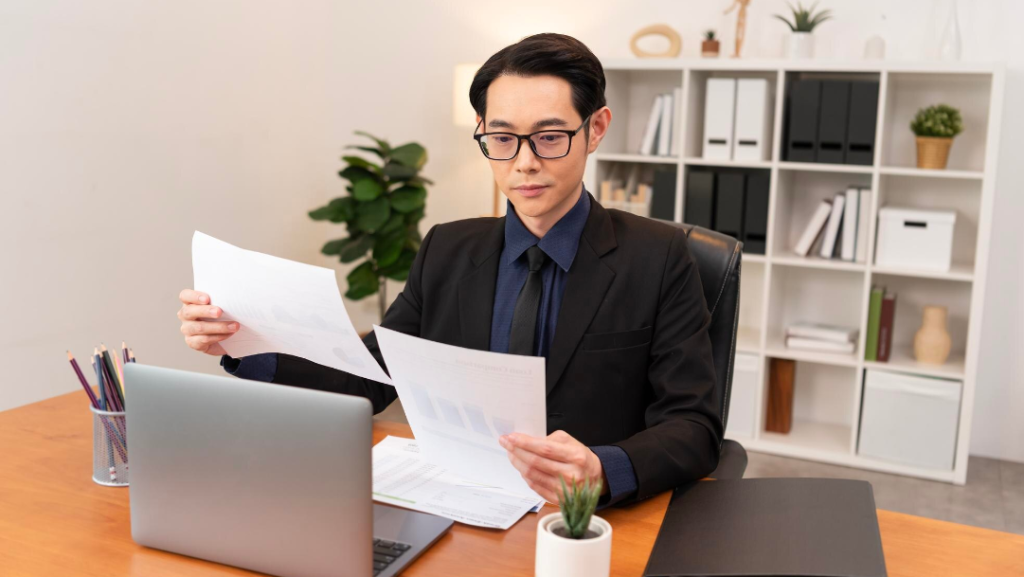 Foreign founder reviewing KYC documents and company constitution for Singapore ACRA registration
