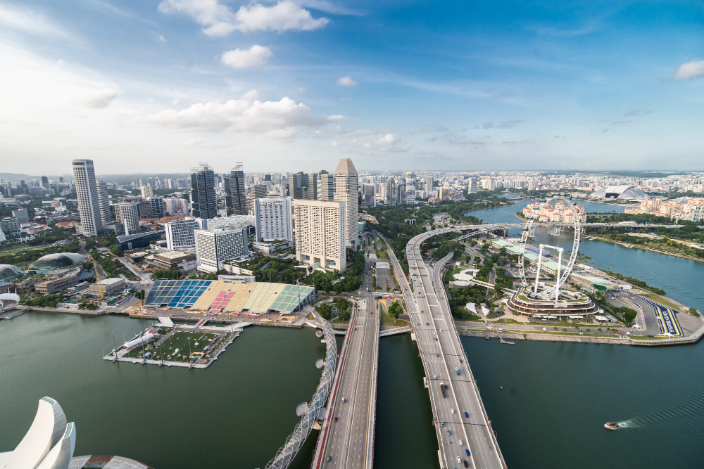 Aerial view of the Singapore skyline and Marina Bay financial district, showcasing modern skyscrapers and advanced infrastructure representing a pro-business economy.